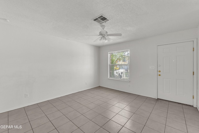 2352 Tierra Blanda Dr, El Paso, TX 79938 - empty room with a ceiling fan, visible vents, a textured ceiling, and light tile patterned flooring
