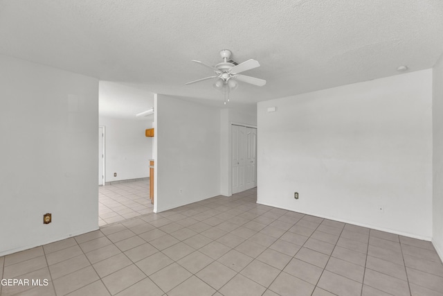 2352 Tierra Blanda Dr, El Paso, TX 79938 - spare room with a textured ceiling, ceiling fan, and light tile patterned floors