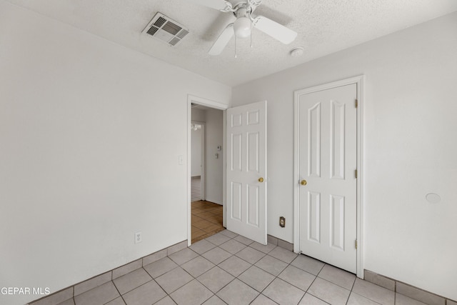 2352 Tierra Blanda Dr, El Paso, TX 79938 - unfurnished bedroom featuring ceiling fan, visible vents, a textured ceiling, and light tile patterned floors