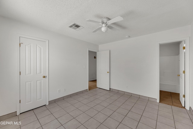 2352 Tierra Blanda Dr, El Paso, TX 79938 - unfurnished bedroom featuring ceiling fan, visible vents, a textured ceiling, and light tile patterned floors