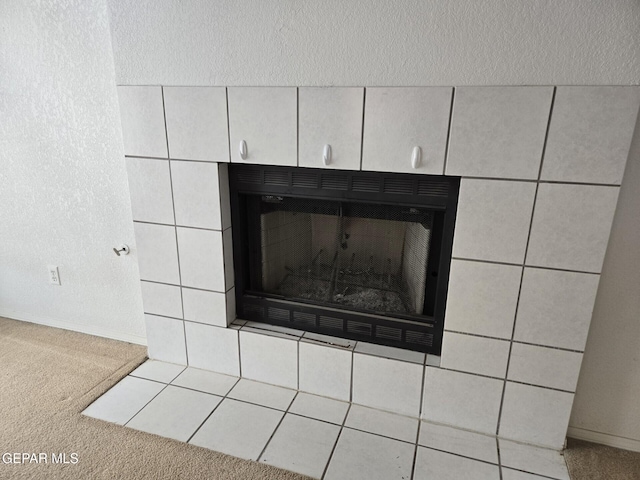 12525 Angie Bombach, El Paso, TX 79936 - detailed view of a tiled fireplace, carpet, and baseboards