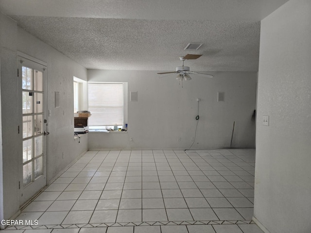 12525 Angie Bombach, El Paso, TX 79936 - unfurnished room with a textured ceiling, a ceiling fan, and light tile patterned floors