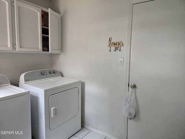 12525 Angie Bombach, El Paso, TX 79936 - laundry area with cabinet space, washing machine and dryer, light tile patterned floors, and baseboards