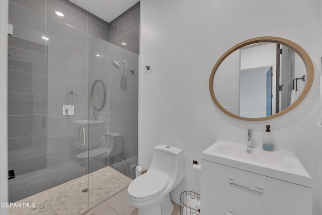 full bath featuring toilet, a shower stall, and vanity