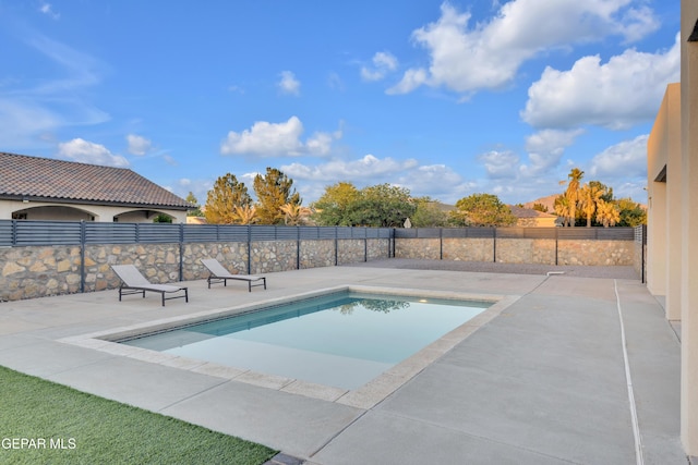 view of pool featuring a fenced in pool, a patio area, and fence