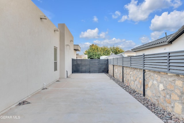 view of patio featuring fence