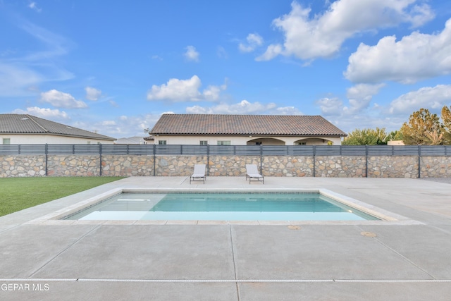 view of pool with a fenced in pool, a patio area, and fence