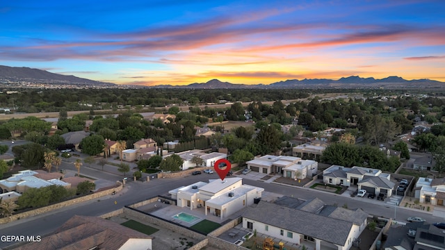 aerial view at dusk with a residential view and a mountain view