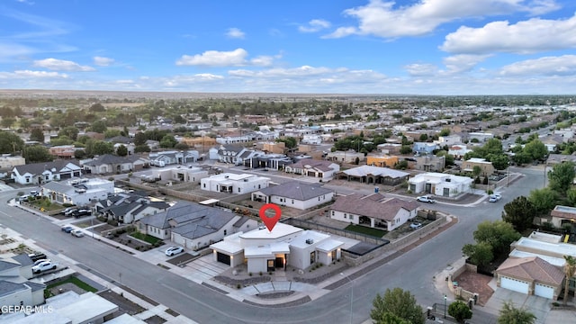 birds eye view of property with a residential view