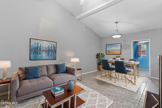 living room featuring high vaulted ceiling and baseboards