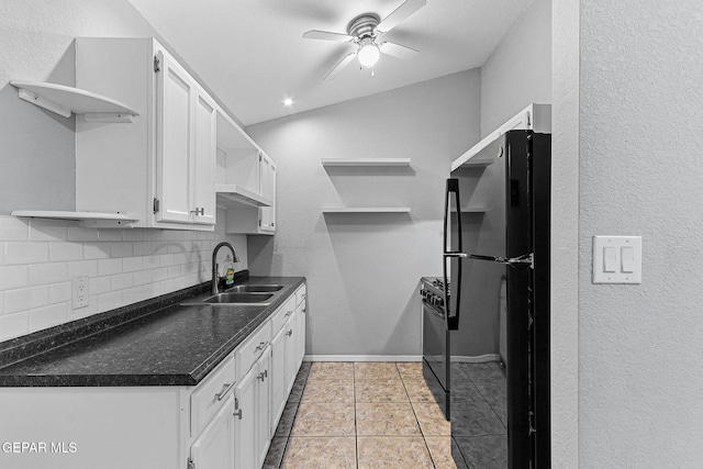 kitchen with decorative backsplash, open shelves, white cabinets, black appliances, and a sink