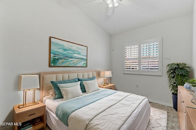 bedroom featuring ceiling fan, vaulted ceiling, and baseboards