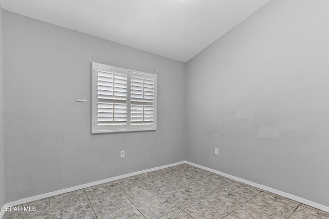 tiled empty room with baseboards