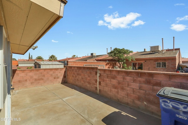 view of patio / terrace with fence and cooling unit