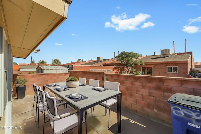 balcony with central AC, a patio, and outdoor dining area