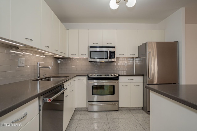 1800 N Stanton Unit 502, El Paso, TX 79902 - kitchen featuring dark countertops, stainless steel appliances, and a sink