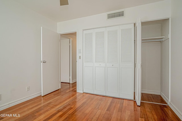 1800 N Stanton Unit 502, El Paso, TX 79902 - unfurnished bedroom featuring light wood-style flooring, visible vents, baseboards, and ceiling fan