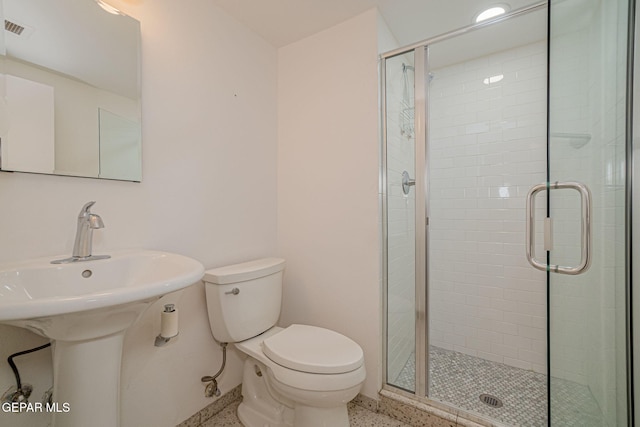 1800 N Stanton Unit 502, El Paso, TX 79902 - bathroom featuring speckled floor, a shower stall, visible vents, and toilet