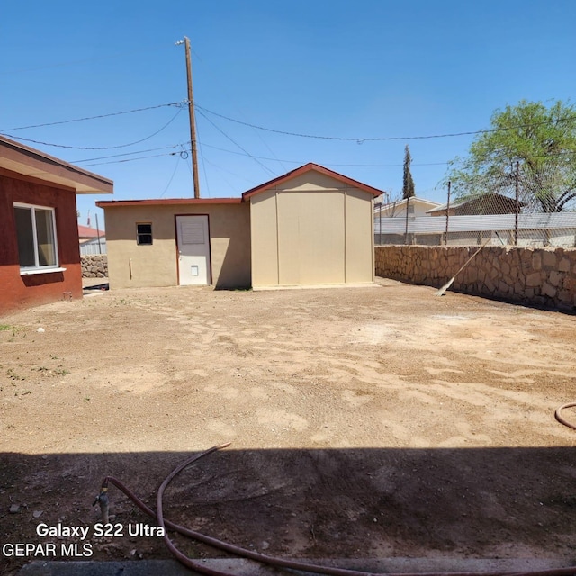 view of outdoor structure with an outdoor structure and fence