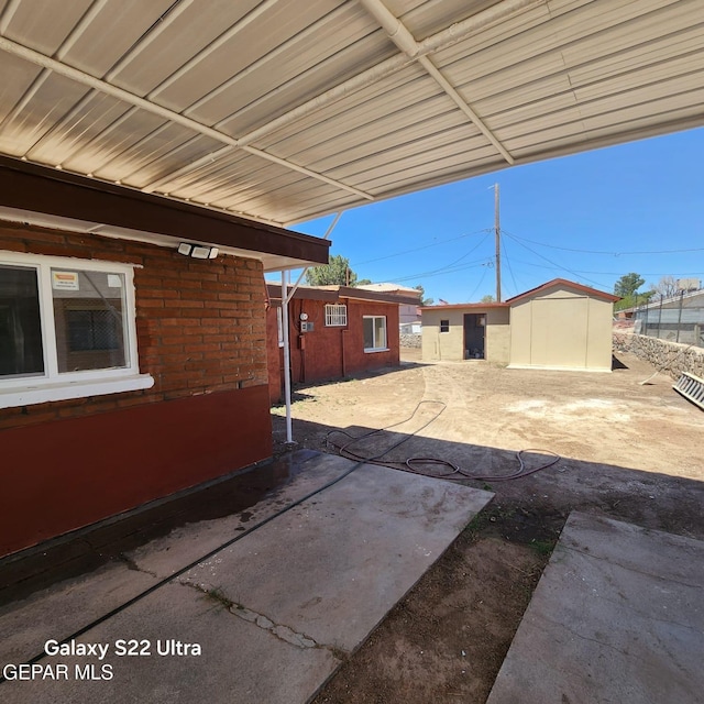view of patio featuring a carport