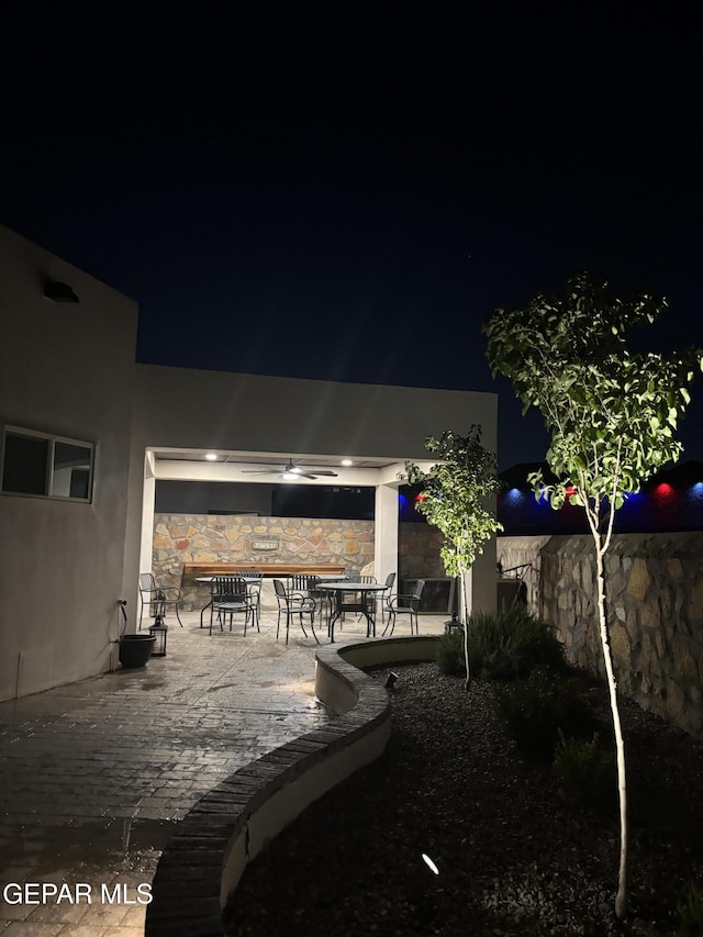12405 Addingham Ct, El Paso, TX 79928 - yard at twilight with a patio area and outdoor dining space
