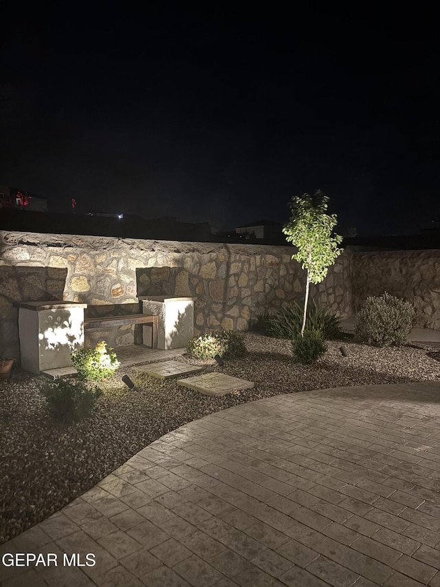 12405 Addingham Ct, El Paso, TX 79928 - view of patio at twilight
