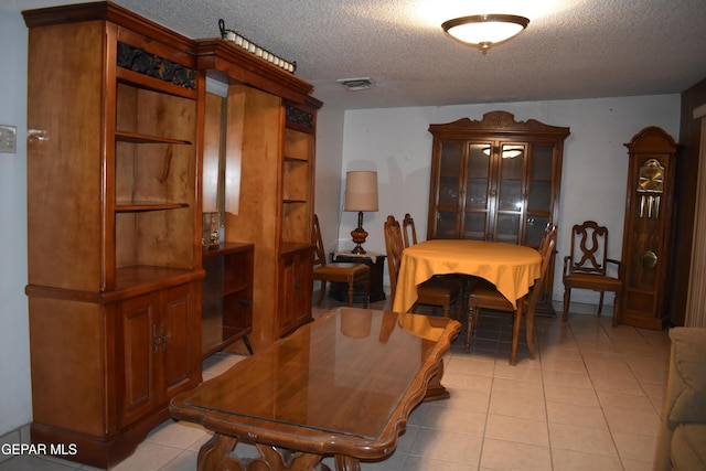 632 Mauer Rd, El Paso, TX 79915 - dining space with light tile patterned floors and a textured ceiling
