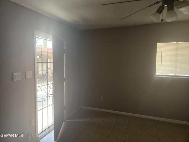 632 Mauer Rd, El Paso, TX 79915 - spare room with ceiling fan and dark tile patterned flooring
