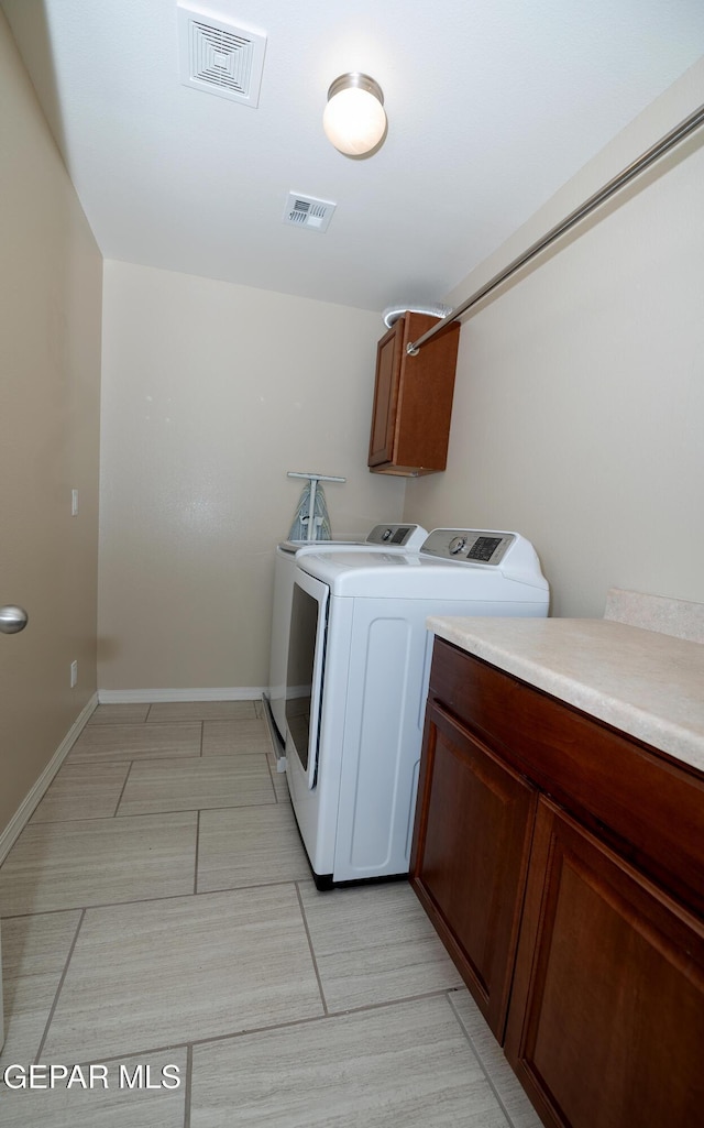 14700 Alton Oaks, El Paso, TX 79938 - laundry area featuring separate washer and dryer, baseboards, cabinet space, and visible vents