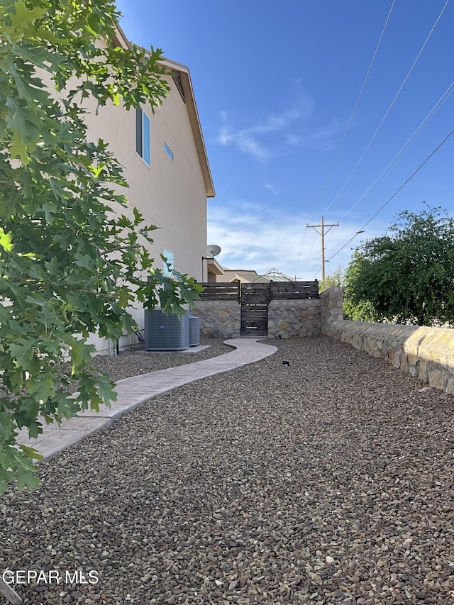 14700 Alton Oaks, El Paso, TX 79938 - view of yard featuring central AC unit