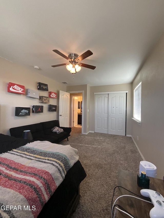 14700 Alton Oaks, El Paso, TX 79938 - carpeted bedroom with baseboards, a wall mounted AC, ceiling fan, and a closet