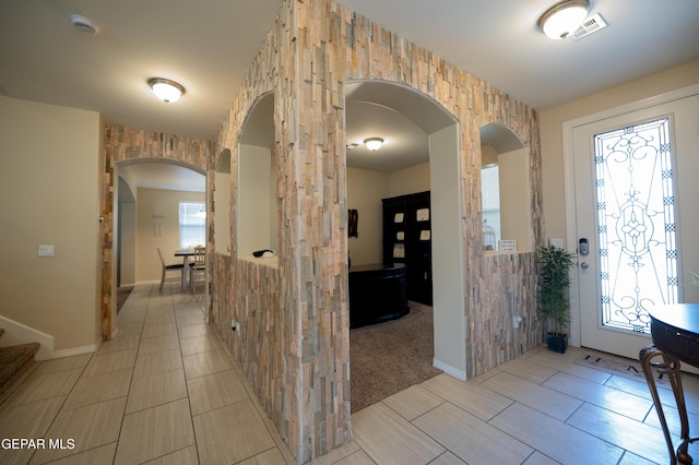 14700 Alton Oaks, El Paso, TX 79938 - entryway with arched walkways, baseboards, visible vents, and a wealth of natural light