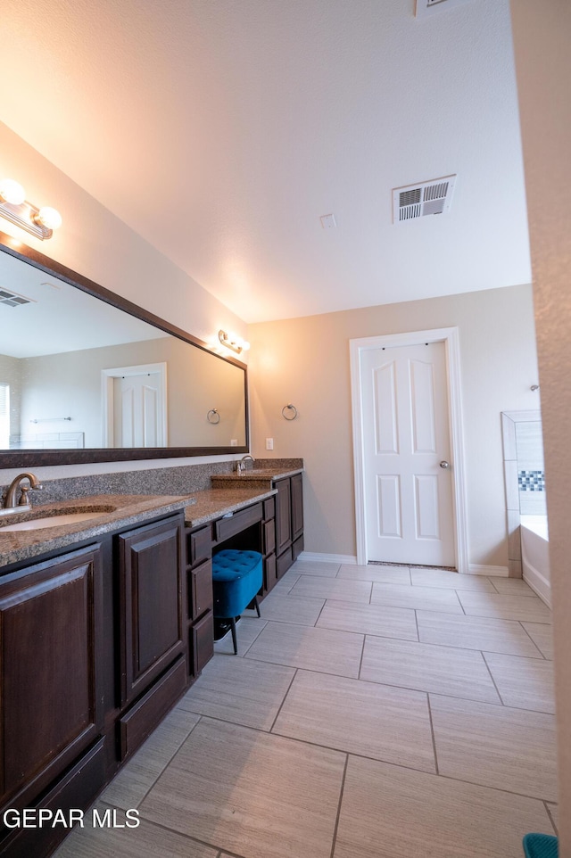 14700 Alton Oaks, El Paso, TX 79938 - full bathroom with double vanity, visible vents, and a sink