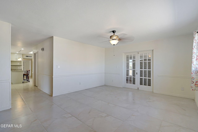 9668 Kathy Ave, El Paso, TX 79927 - unfurnished room with visible vents, a ceiling fan, and baseboards