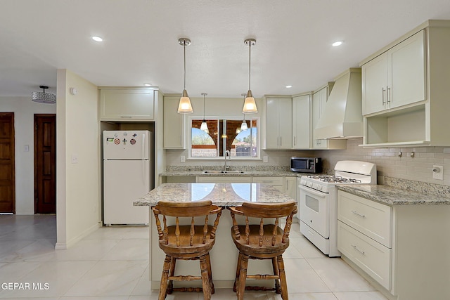 9668 Kathy Ave, El Paso, TX 79927 - kitchen featuring wall chimney range hood, a sink, decorative backsplash, white appliances, and light stone countertops