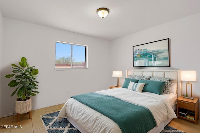 9668 Kathy Ave, El Paso, TX 79927 - bedroom featuring baseboards and light tile patterned floors