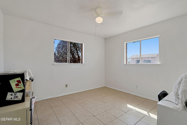 9668 Kathy Ave, El Paso, TX 79927 - spare room featuring baseboards, ceiling fan, and light tile patterned flooring