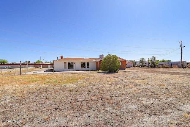9668 Kathy Ave, El Paso, TX 79927 - view of front of house with fence and a chimney