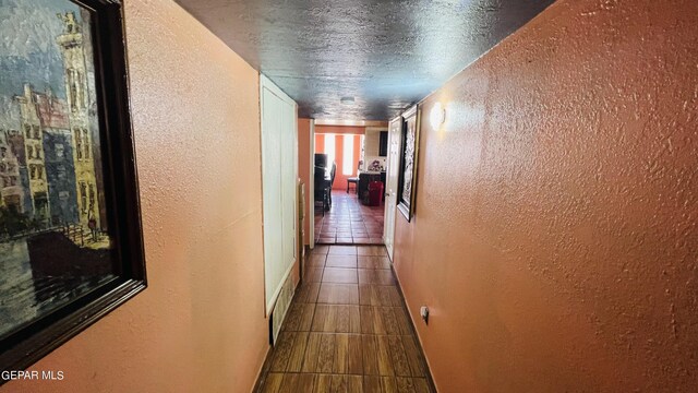 610 Jewels Dr, Socorro, TX 79927 - hallway with a textured wall, visible vents, a textured ceiling, and tile patterned floors