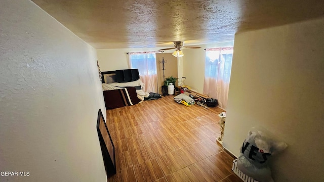 610 Jewels Dr, Socorro, TX 79927 - living area with tile patterned floors and ceiling fan