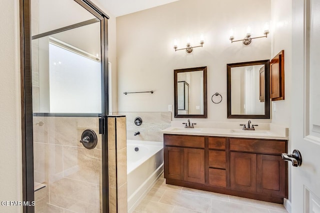 11969 Medalla St, Socorro, TX 79927 - bathroom featuring double vanity, a garden tub, a stall shower, and a sink