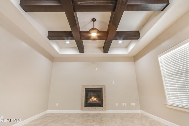 11969 Medalla St, Socorro, TX 79927 - unfurnished living room with a glass covered fireplace, beam ceiling, and coffered ceiling
