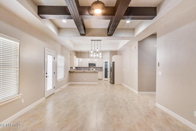 11969 Medalla St, Socorro, TX 79927 - unfurnished living room featuring coffered ceiling, beam ceiling, and baseboards