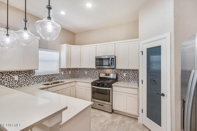 11969 Medalla St, Socorro, TX 79927 - kitchen featuring tasteful backsplash, stainless steel appliances, light countertops, and a sink