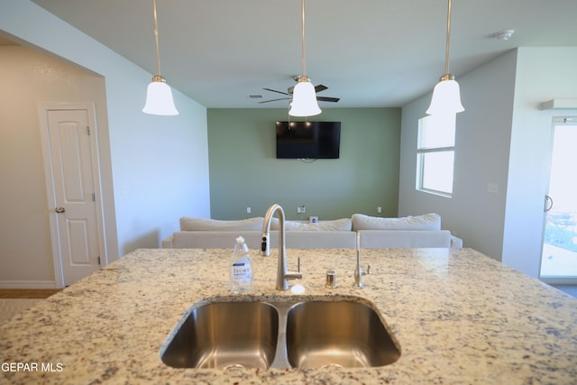 1628 Sam Dominguez, El Paso, TX 79928 - kitchen featuring light stone countertops, pendant lighting, open floor plan, and a sink