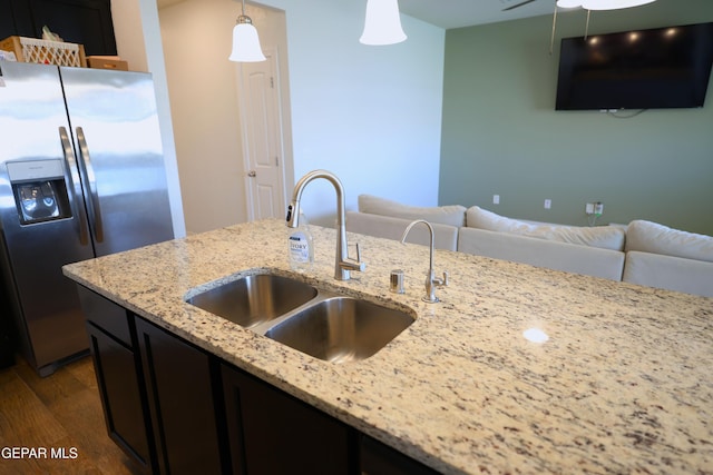 1628 Sam Dominguez, El Paso, TX 79928 - kitchen with dark wood finished floors, stainless steel fridge with ice dispenser, open floor plan, and a sink