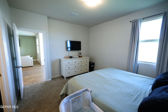 1628 Sam Dominguez, El Paso, TX 79928 - bedroom featuring baseboards, visible vents, and carpet