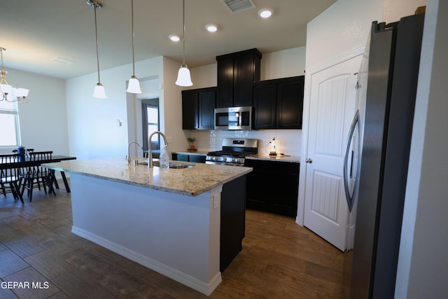 1628 Sam Dominguez, El Paso, TX 79928 - kitchen with a sink, dark wood finished floors, tasteful backsplash, visible vents, and appliances with stainless steel finishes