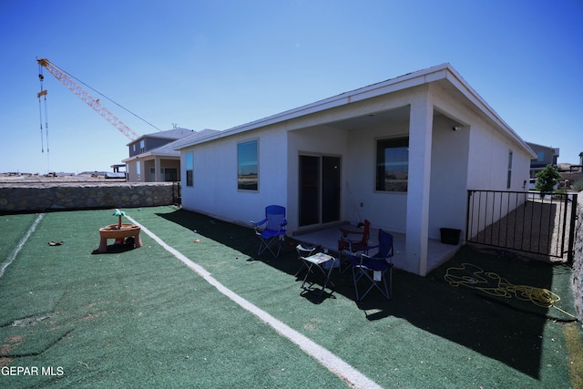 1628 Sam Dominguez, El Paso, TX 79928 - rear view of property featuring stucco siding and fence