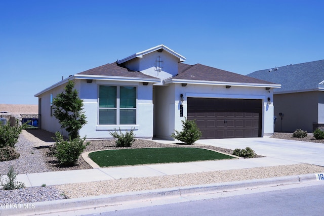 1628 Sam Dominguez, El Paso, TX 79928 - ranch-style home with stucco siding, an attached garage, and driveway